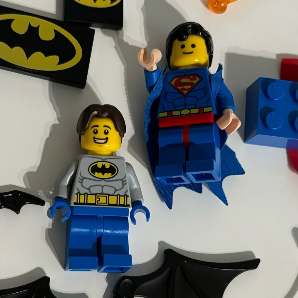 Legos, Superman, Batman, various Batman and Spider man parts.